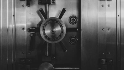 Black and white photo of a bank vault door
