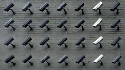 Group of security cameras on a wall